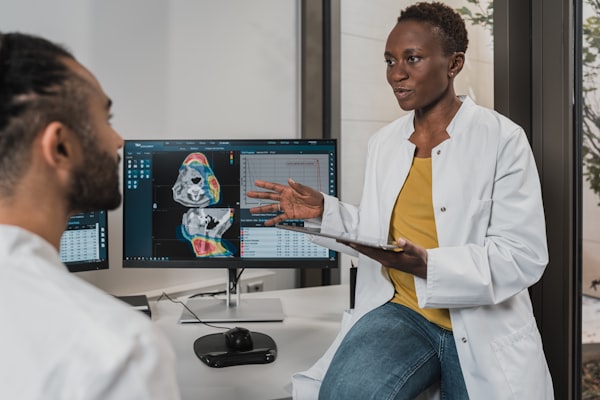 Two clinicians reviewing a scan